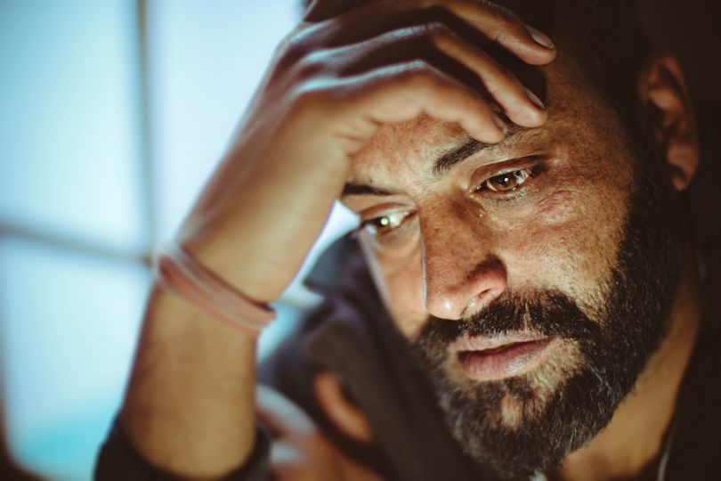 Man holding his head