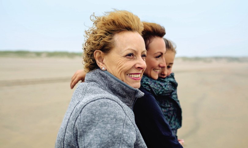 Three generations of women smiling