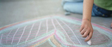 Drawing a heart on the floor with chalk