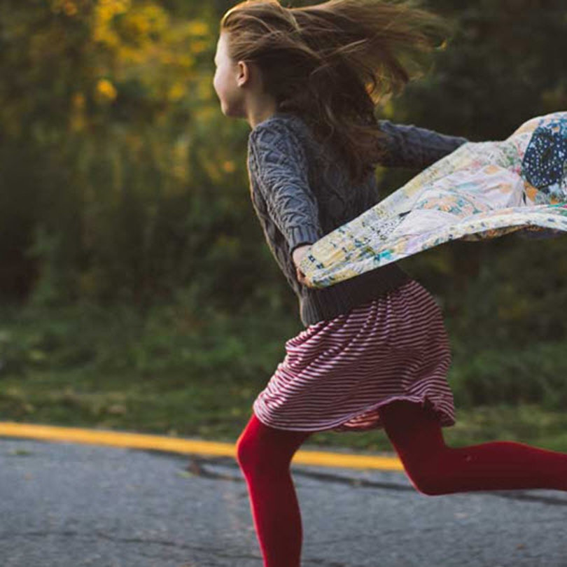 Girl running on the road